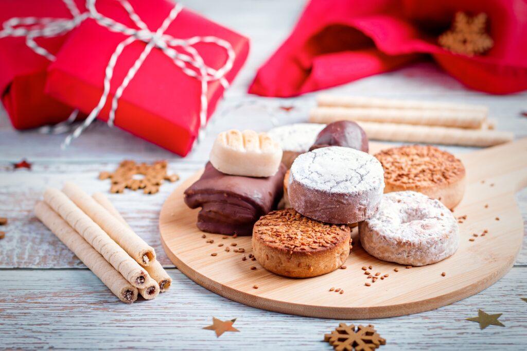 Christmas sweets turron, polvorones, mantecados on grey table top