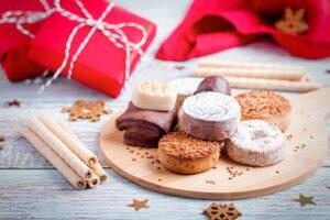 Christmas sweets turron, polvorones, mantecados on grey table top
