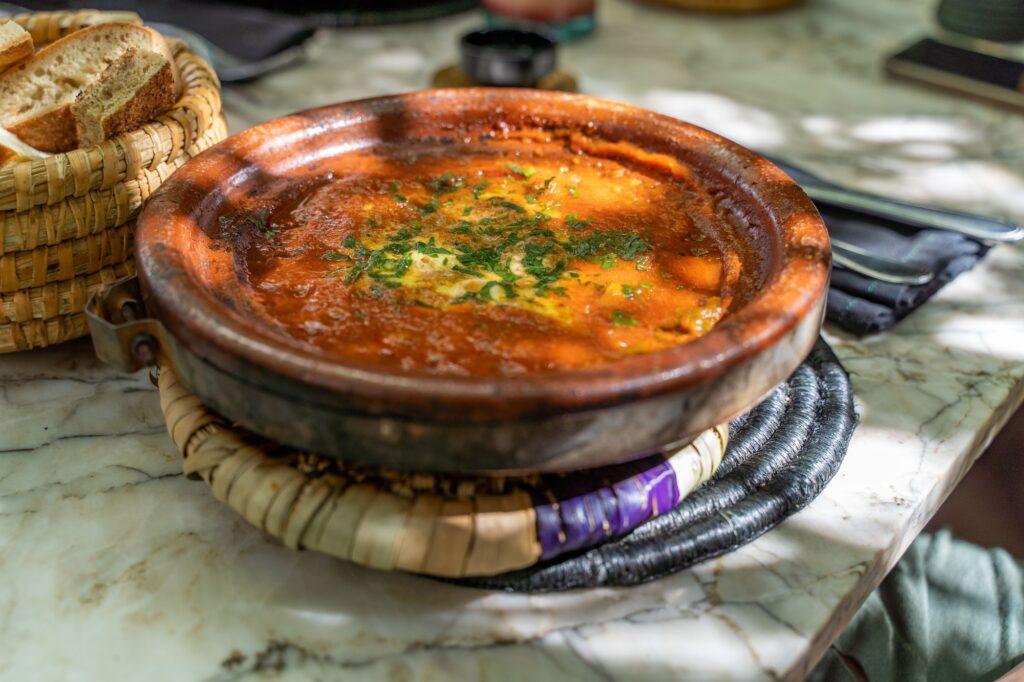 Closeup of traditional Tagine Kefta on a table in a restaurant in Marrakech, Morocco.