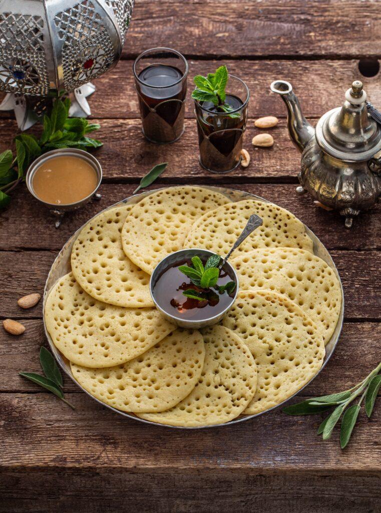 Moroccan pancakes Baghrir or crepes with 1000 holes served with honey and mint tea