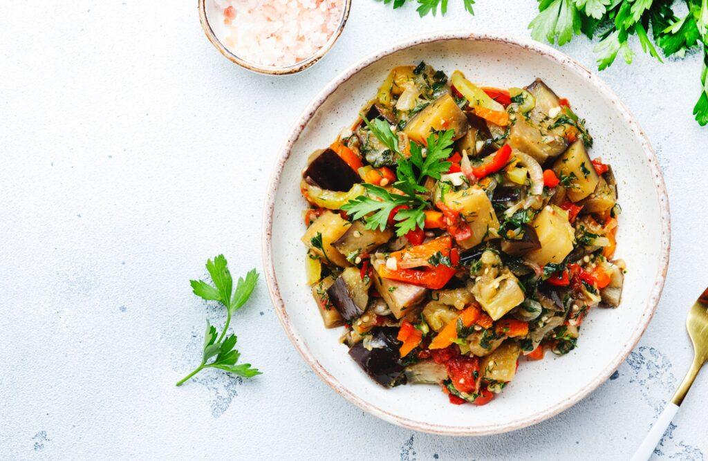 Vegetable stew, saute or caponata. Stewed eggplant with paprika, tomatoes, spices