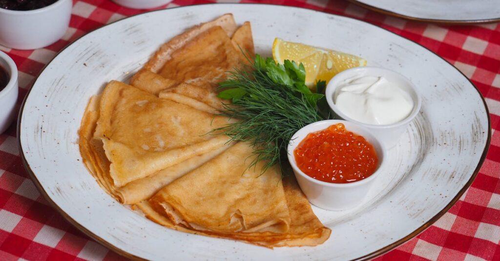 découvrez la délicatesse des blinis, petites crêpes légères et moelleuses, parfaites pour accompagner vos apéritifs ou garnitures. apprenez à les préparer facilement à la maison et savourez leur goût délicieux, idéals pour impressionner vos invités lors de vos réceptions.