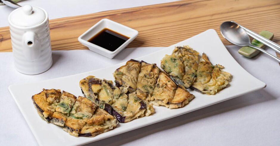 découvrez nos délicieuses beignets d'aubergine croustillants, un en-cas savoureux et croustillant idéal pour toutes les occasions. faciles à préparer, ces fritters d'aubergine sont parfaits pour impressionner vos invités ou savourer lors d'un repas convivial.